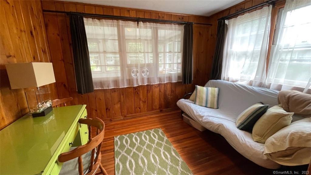 68 Kelsey Place Madison, CT 06443 - Photo 10 of 18 a living room with furniture and a large window