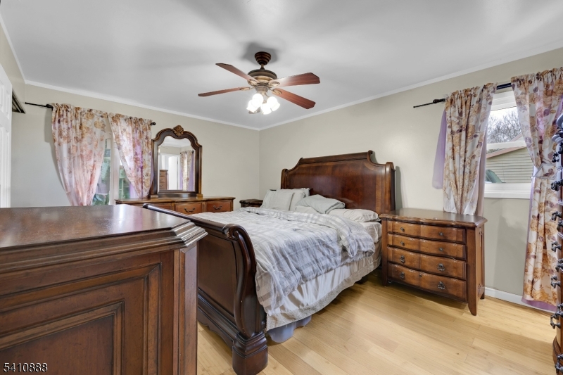 30 General Lane Willingboro, NJ 08046 - Photo 16 of 22 a bedroom with a bed and a chandelier