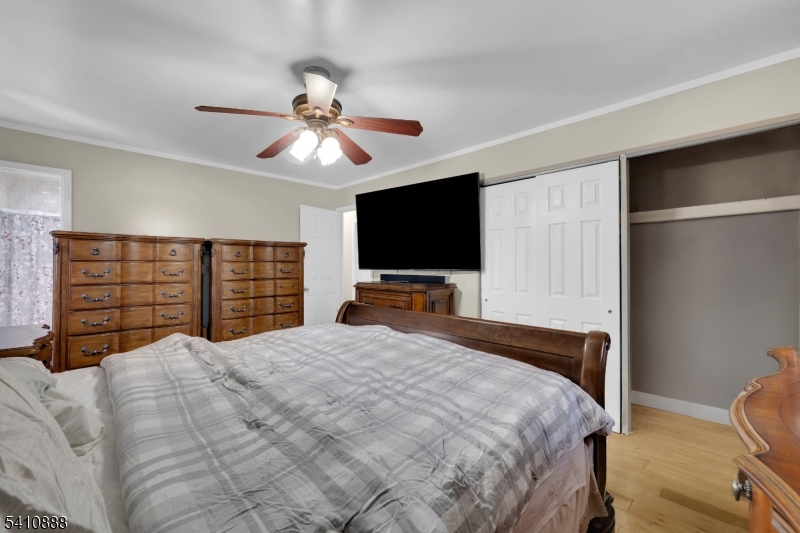 30 General Lane Willingboro, NJ 08046 - Photo 17 of 22 a bedroom with a bed and a flat screen tv