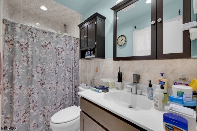 30 General Lane Willingboro, NJ 08046 - Photo 18 of 22 a bathroom with a sink and a mirror