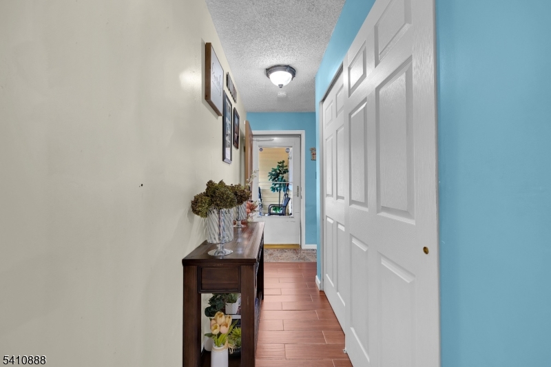 30 General Lane Willingboro, NJ 08046 - Photo 6 of 22 a view of a hallway with wooden floor and staircase