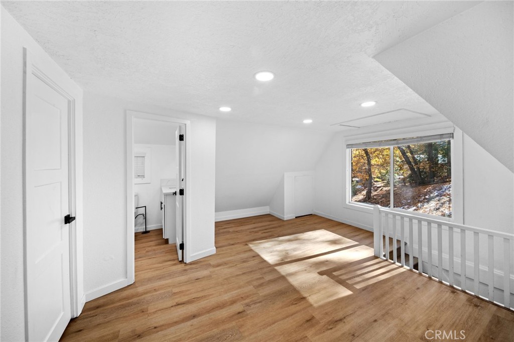 180 Glen Avon Drive Cedar Glen, CA 92321 - Photo 14 of 24 a view of hallway with wooden floor and windows