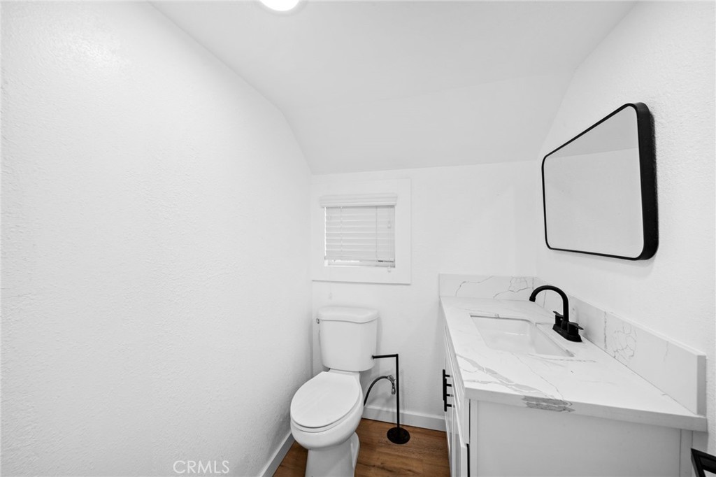 180 Glen Avon Drive Cedar Glen, CA 92321 - Photo 15 of 24 a bathroom with a toilet sink and mirror