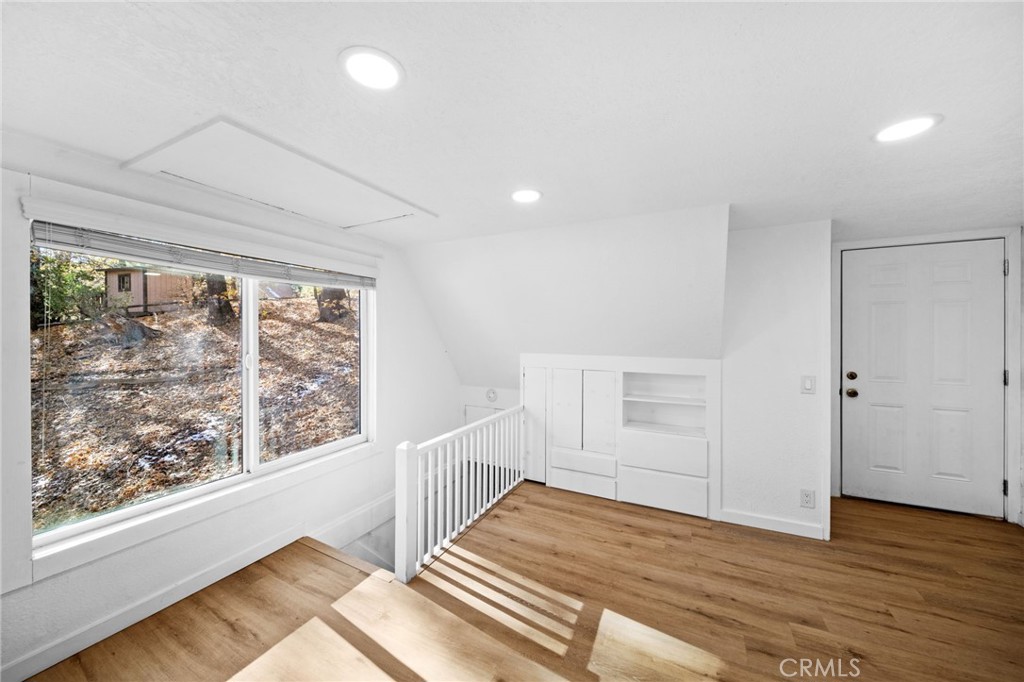 180 Glen Avon Drive Cedar Glen, CA 92321 - Photo 16 of 24 a view of a room with wooden floor and windows