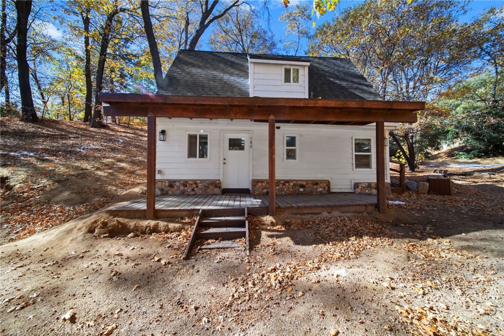 180 Glen Avon Drive Cedar Glen, CA 92321 - Photo 2 of 24 a front view of a house with garden