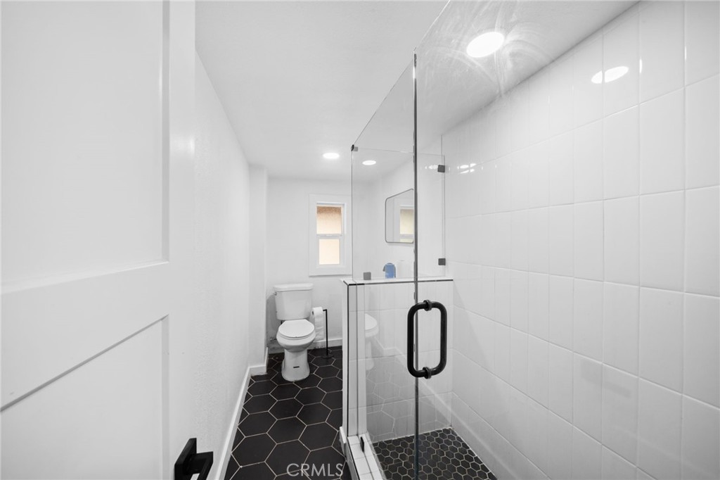 180 Glen Avon Drive Cedar Glen, CA 92321 - Photo 9 of 24 a bathroom with a shower a toilet and a sink