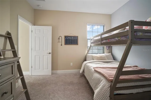 a bed room with a bed and a window