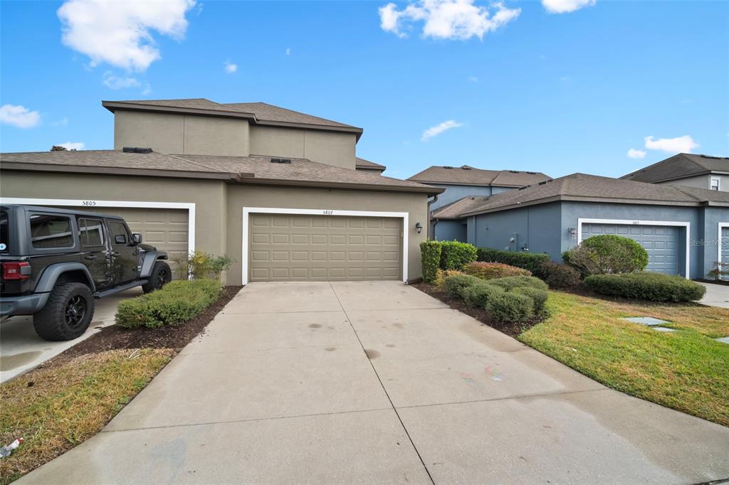 5807 Circa Fishhawk Boulevard Lithia, FL 33547 - Photo 25 of 40 a front view of a house with garden