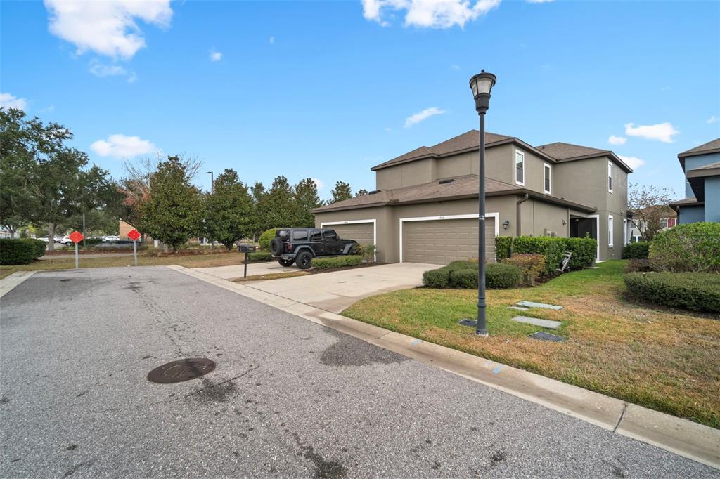 5807 Circa Fishhawk Boulevard Lithia, FL 33547 - Photo 26 of 40 a front view of a house with a yard and garage