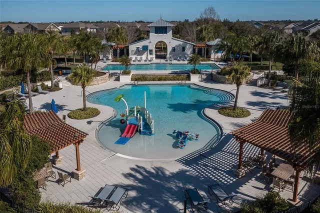 an aerial view of a house having patio