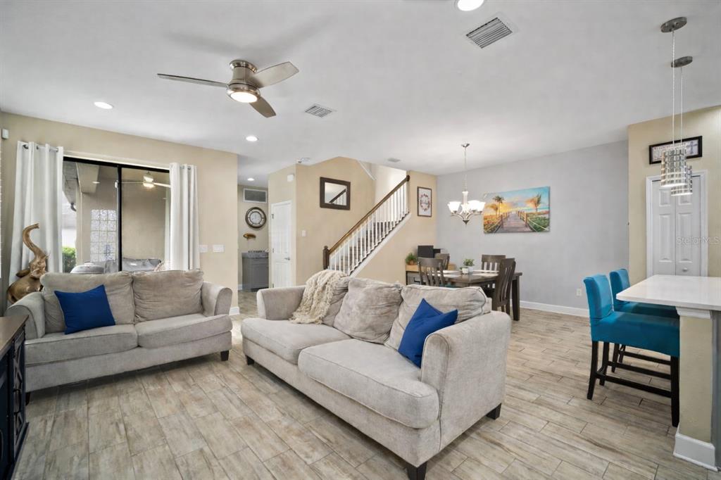 5807 Circa Fishhawk Boulevard Lithia, FL 33547 - Photo 6 of 40 a living room with furniture and a wooden floor