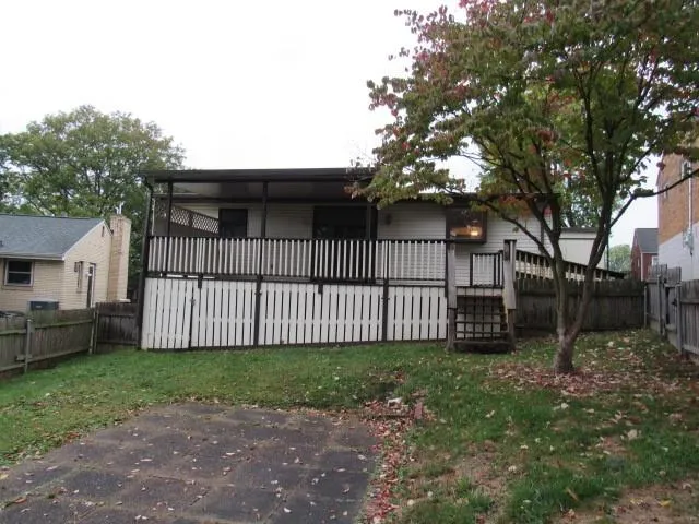 a view of a backyard with a small cabin