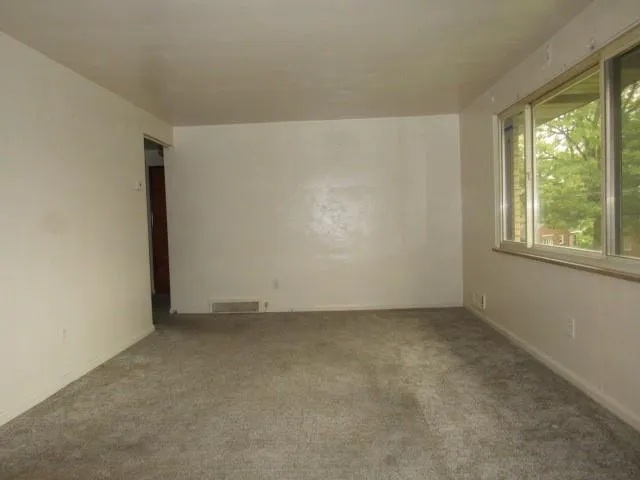 an empty room with windows