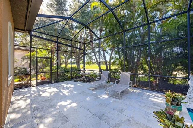 a view of a garage with wooden table and chairs