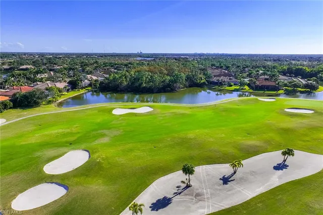 a view of a golf course with a building in the background