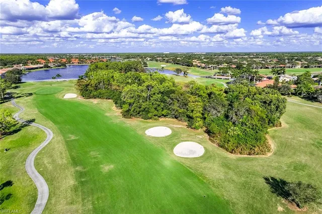 a street view with flower plants and wooden fence