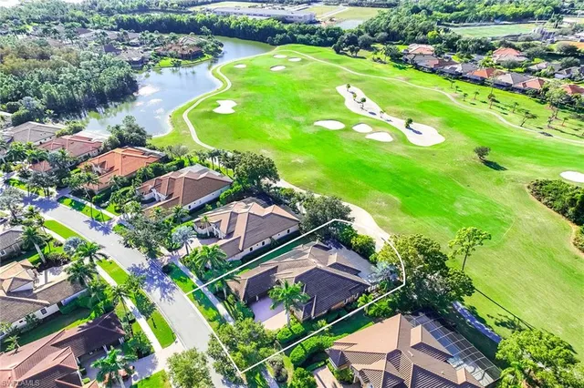 an aerial view of lake residential houses with outdoor space and swimming pool