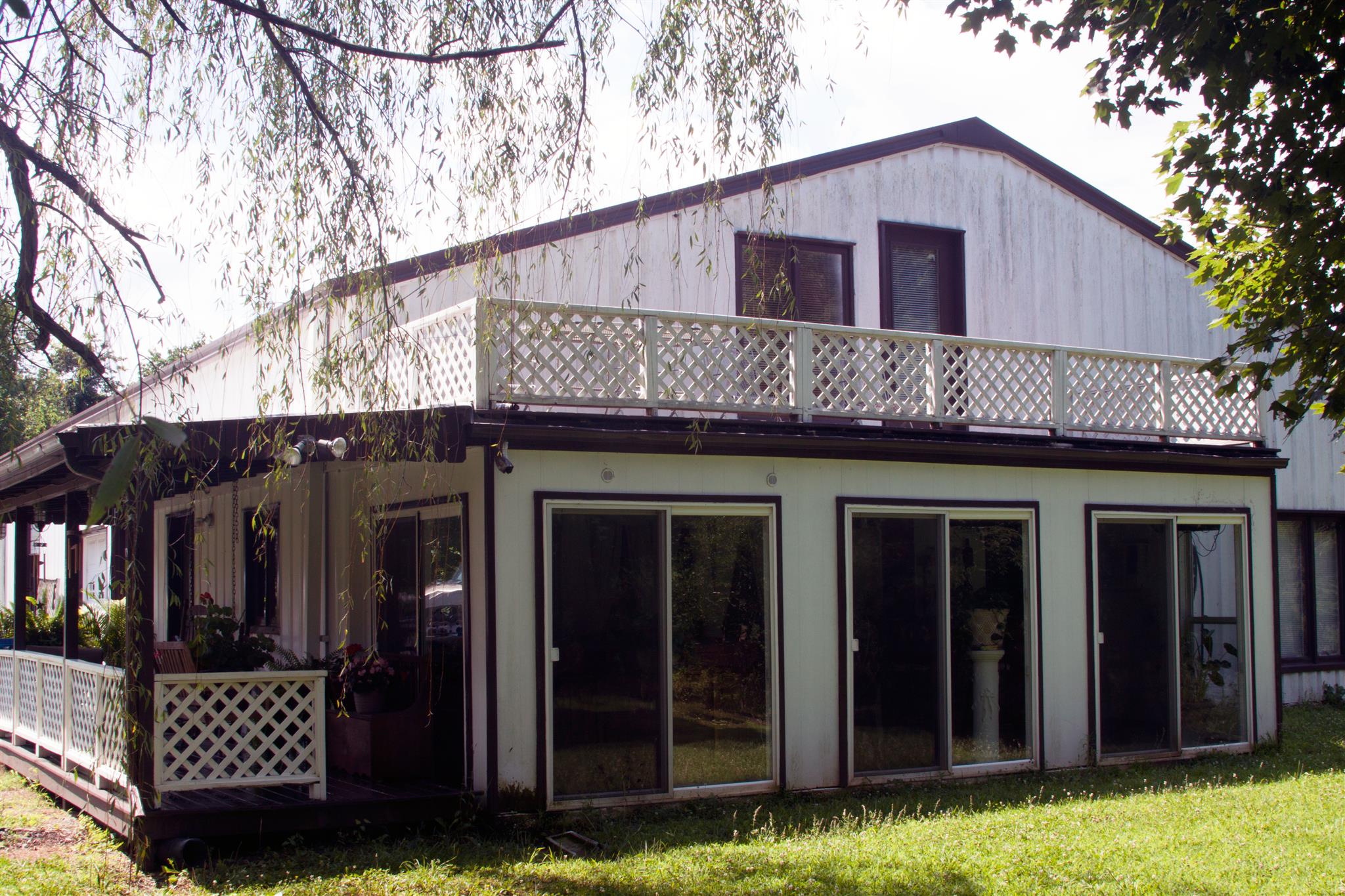 3932 Pleasant Grove Road White House, TN 37188 - Photo 1 of 14 a front view of a house with a yard
