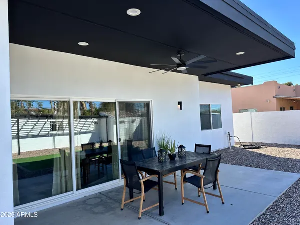 a dining room with furniture and wooden floor