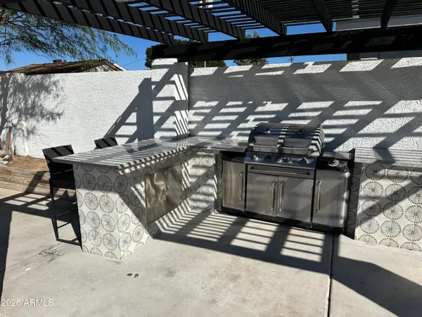 a living room with furniture and white walls