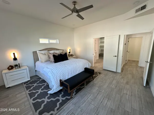 a kitchen with stainless steel appliances granite countertop a refrigerator stove and sink