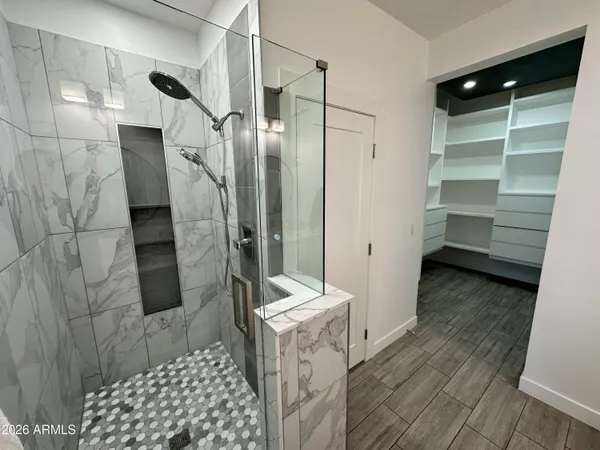 a view of a room with shelf on the wall