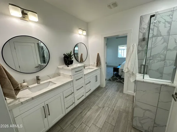 a bedroom with a bed and a dresser