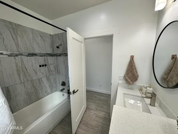 a living room with furniture a rug and a chandelier