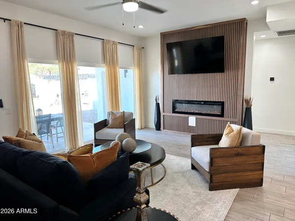 a view of a dining room with furniture and wooden floor