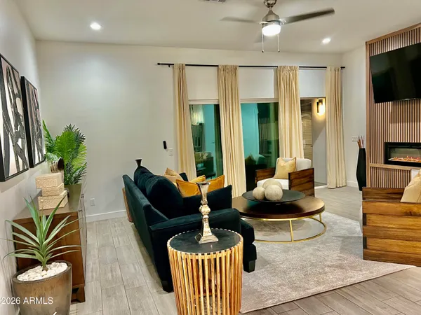 a kitchen with stainless steel appliances granite countertop a sink a stove and a wooden floors