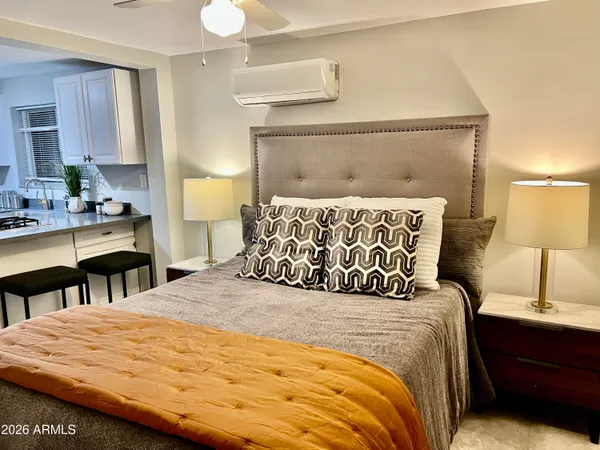 a view of a dining room with furniture and a chandelier