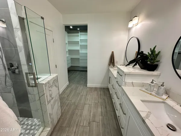 a view of walk in closet with empty racks