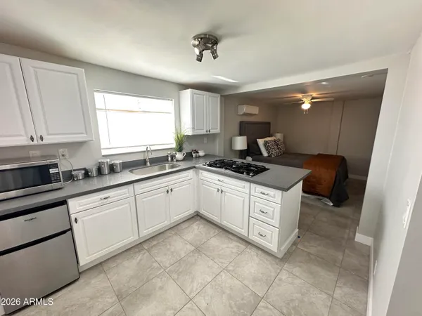 a bathroom with a sink a mirror and a bathtub