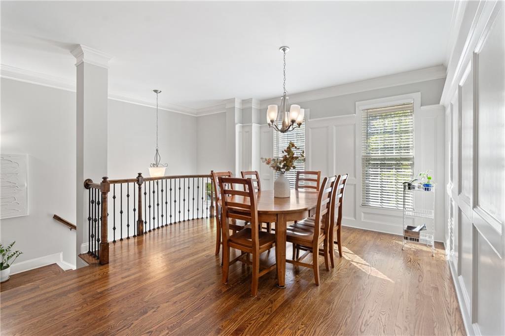 2015 Eagle Ridge Roswell, GA 30076 - Photo 12 of 47 a view of a dining room and livingroom with furniture wooden floor a chandelier