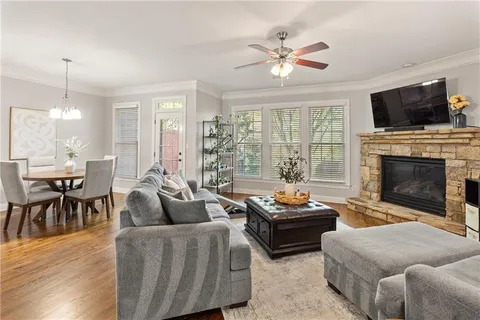 a living room with furniture fireplace and flat screen tv