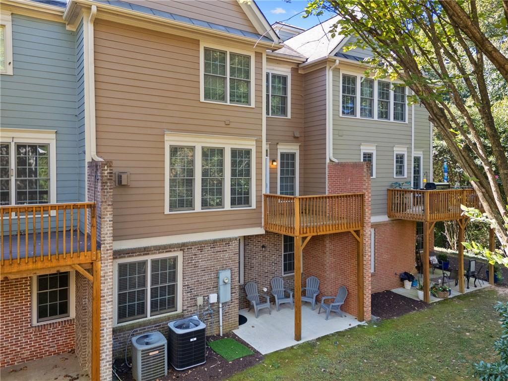 2015 Eagle Ridge Roswell, GA 30076 - Photo 32 of 47 a front view of a house with a yard