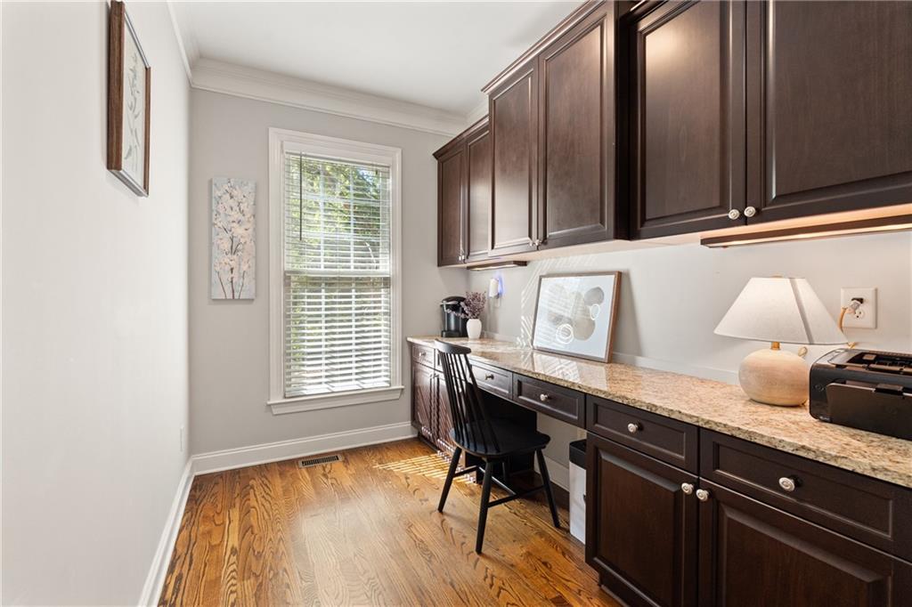 2015 Eagle Ridge Roswell, GA 30076 - Photo 10 of 47 a kitchen with granite countertop wooden cabinets and wooden floor