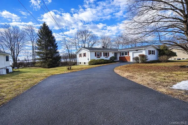 a view of a house with a yard