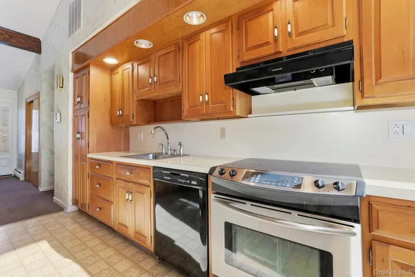 a kitchen that has a cabinets counter space and a window