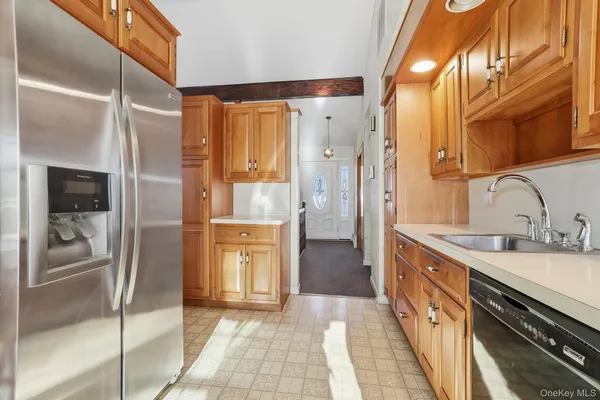 a bathroom with a granite countertop toilet sink and mirror