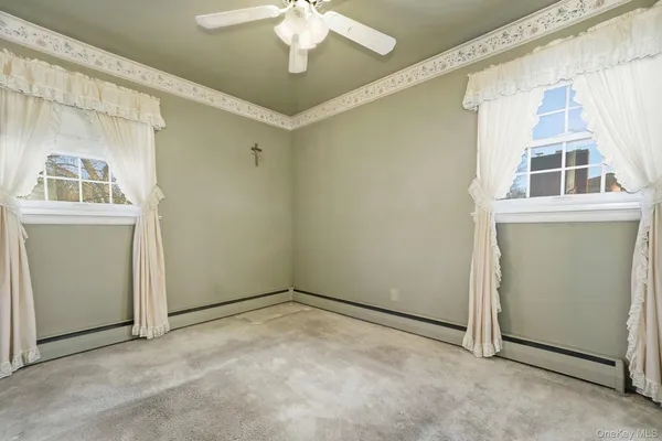 a view of empty room with windows