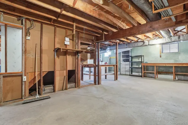 a view of an empty room with wooden walls