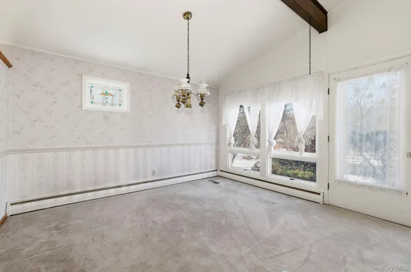 a kitchen with granite countertop a refrigerator and a sink