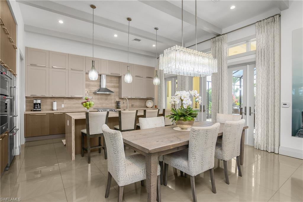 14852 Dockside Lane Naples, FL 34114 - Photo 1 of 49 a view of a dining room and livingroom with furniture wooden floor a chandelier