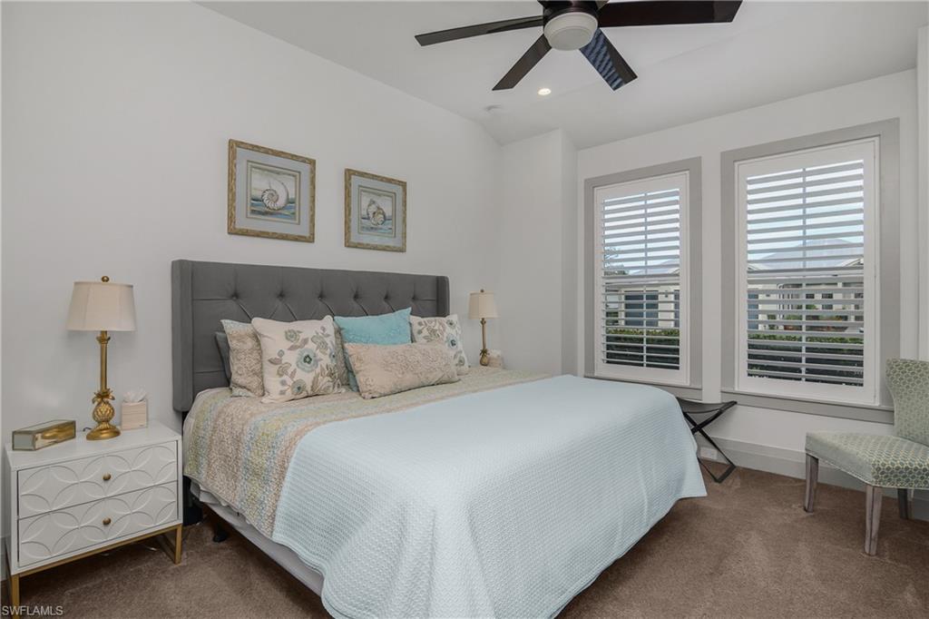 14852 Dockside Lane Naples, FL 34114 - Photo 17 of 49 a bedroom with a bed and a window