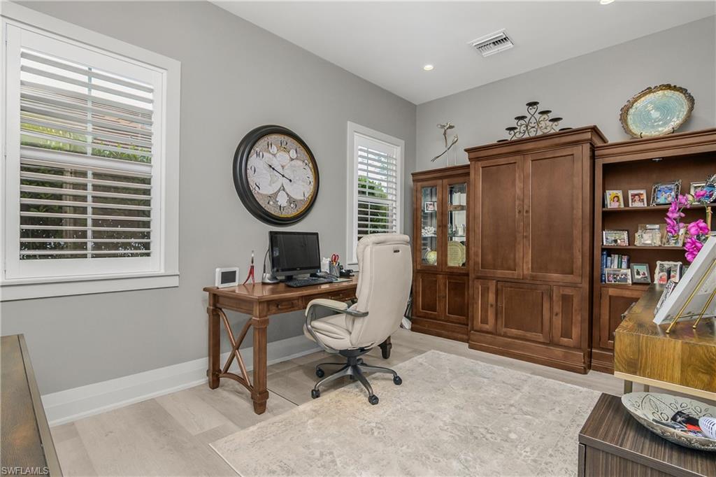 14852 Dockside Lane Naples, FL 34114 - Photo 24 of 49 a view of a room with gym equipment