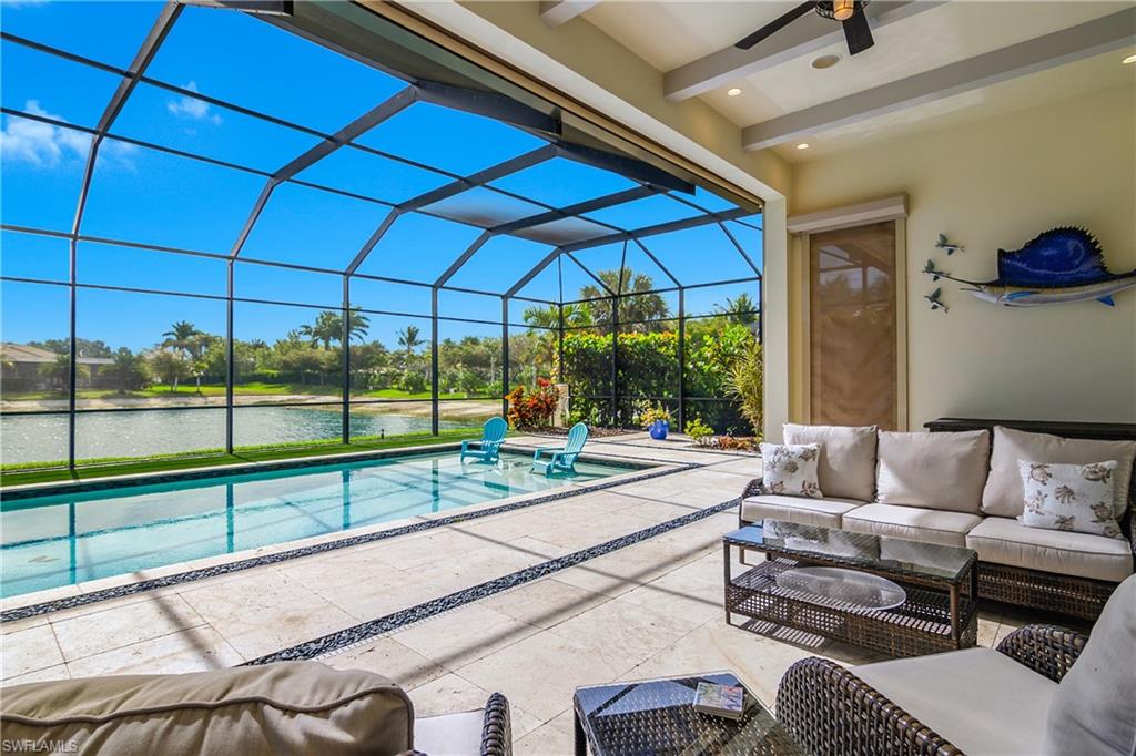 14852 Dockside Lane Naples, FL 34114 - Photo 33 of 49 a living room with a couch and a table