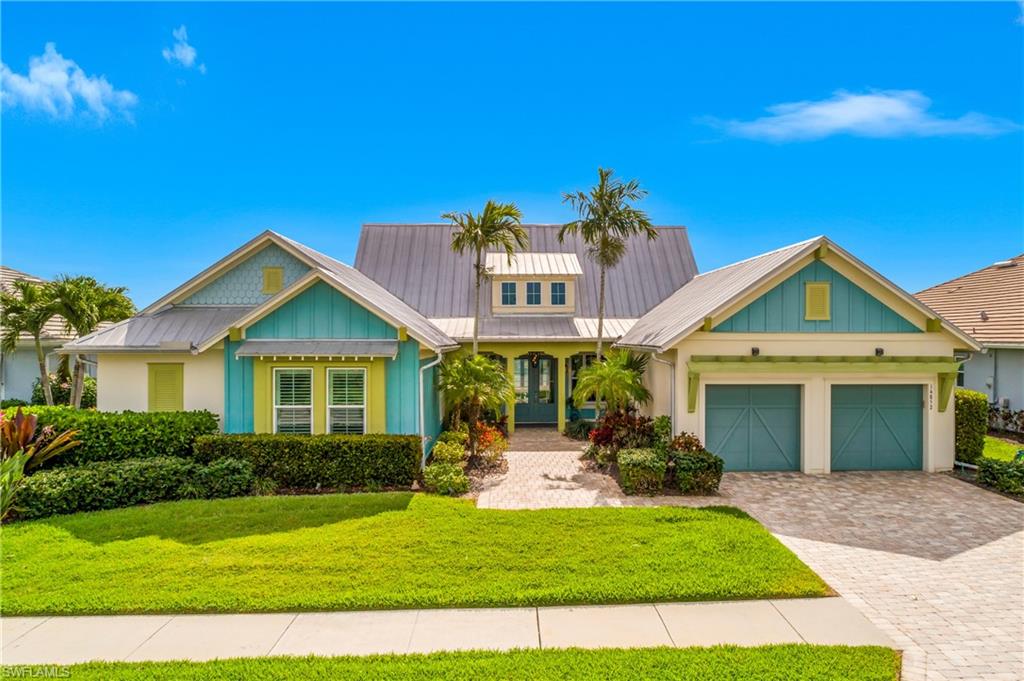 14852 Dockside Lane Naples, FL 34114 - Photo 36 of 49 a front view of a house with a yard