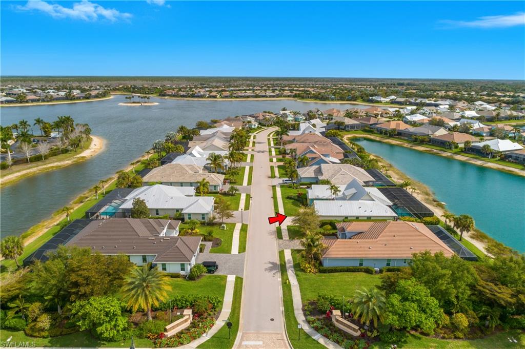 14852 Dockside Lane Naples, FL 34114 - Photo 39 of 49 an aerial view of a house with a lake view