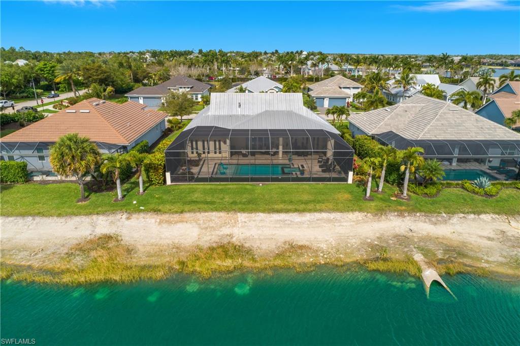 14852 Dockside Lane Naples, FL 34114 - Photo 41 of 49 a view of a house with a yard